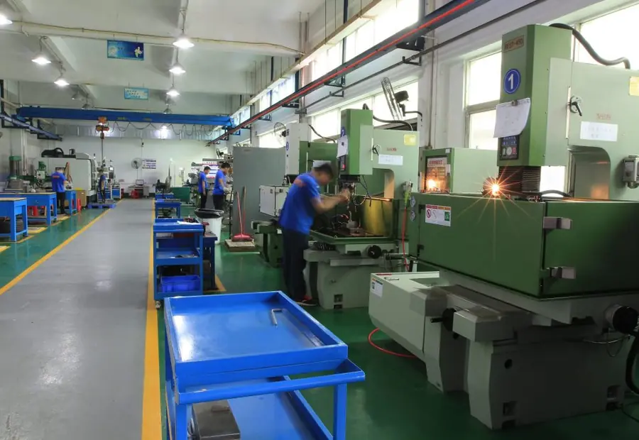 Row of EDM machines on the GY Machining shop floor