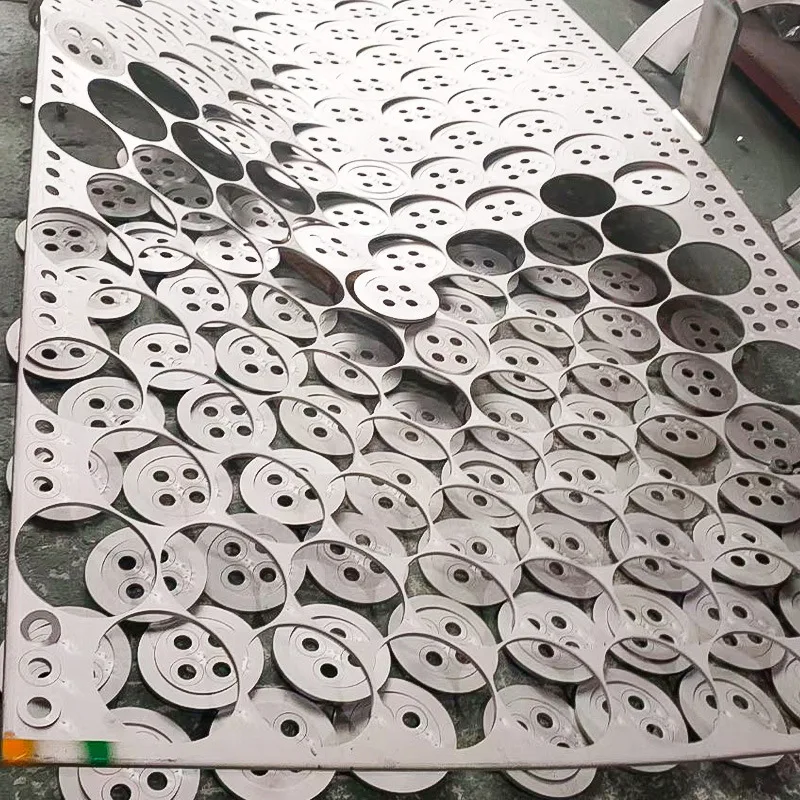 Laser-cut stainless steel discs nested in the sheet at our partner plant