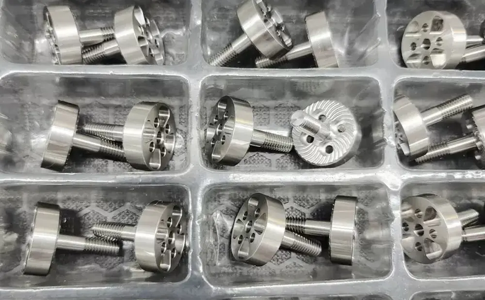 Finished stainless steel turned parts packed in a tray